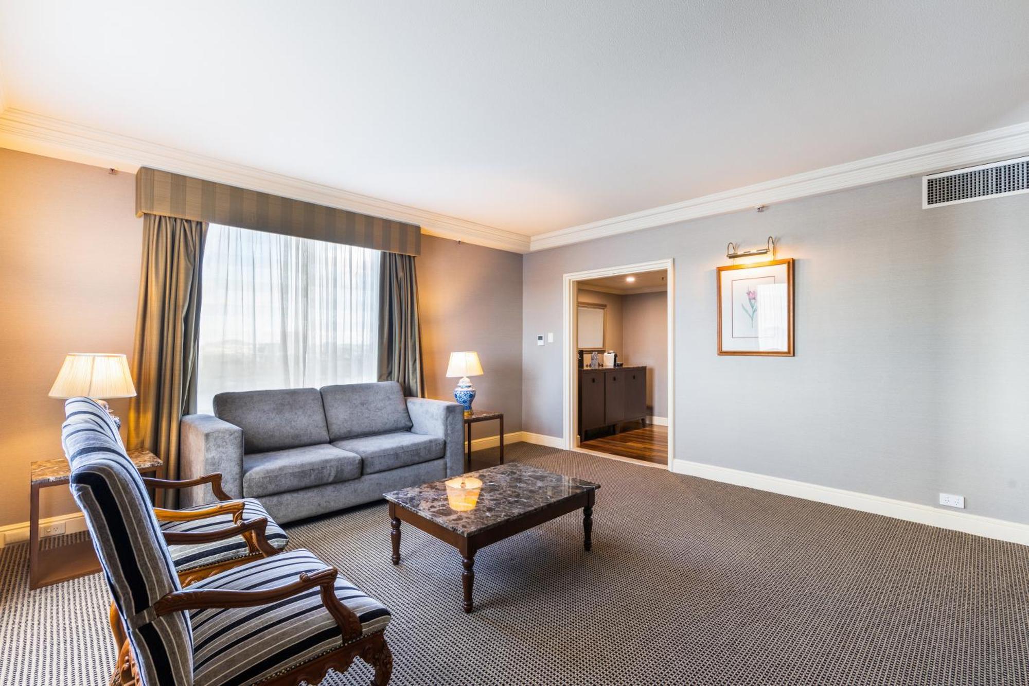 فندق ستامفورد بلازا بريسبان بريزبين المظهر الخارجي الصورة A living room at the hotel